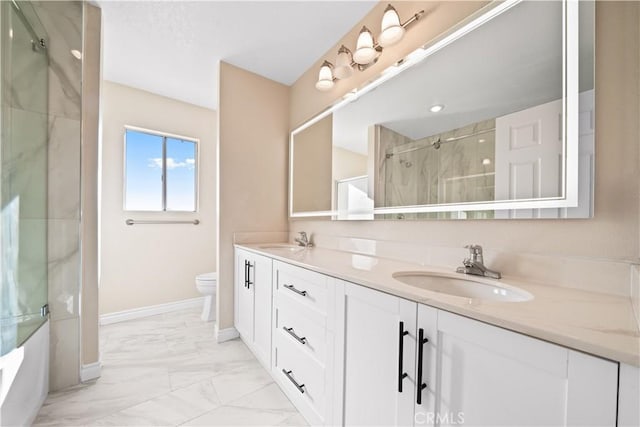 bathroom with toilet, a shower with door, and vanity