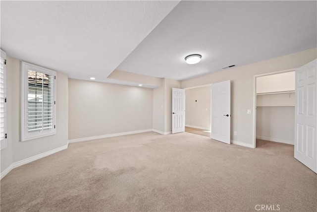 basement with light colored carpet