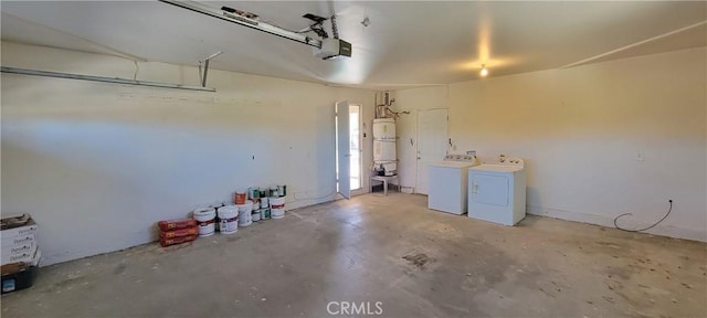 garage with water heater, a garage door opener, and independent washer and dryer