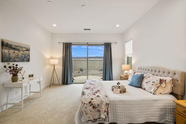 carpeted bedroom featuring access to exterior