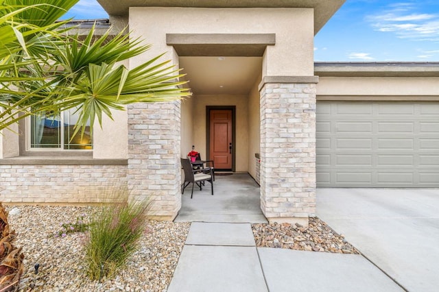 view of exterior entry featuring a garage