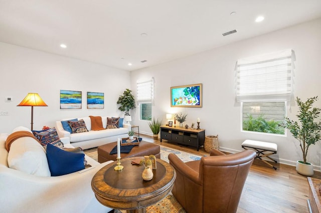 living room with light hardwood / wood-style flooring