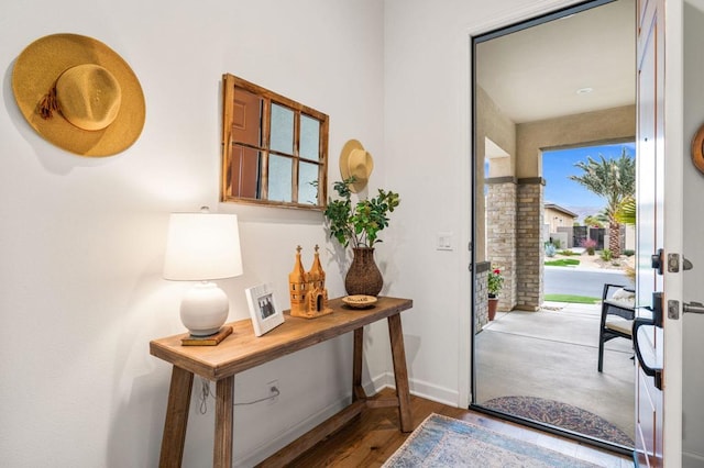 doorway to outside with hardwood / wood-style floors