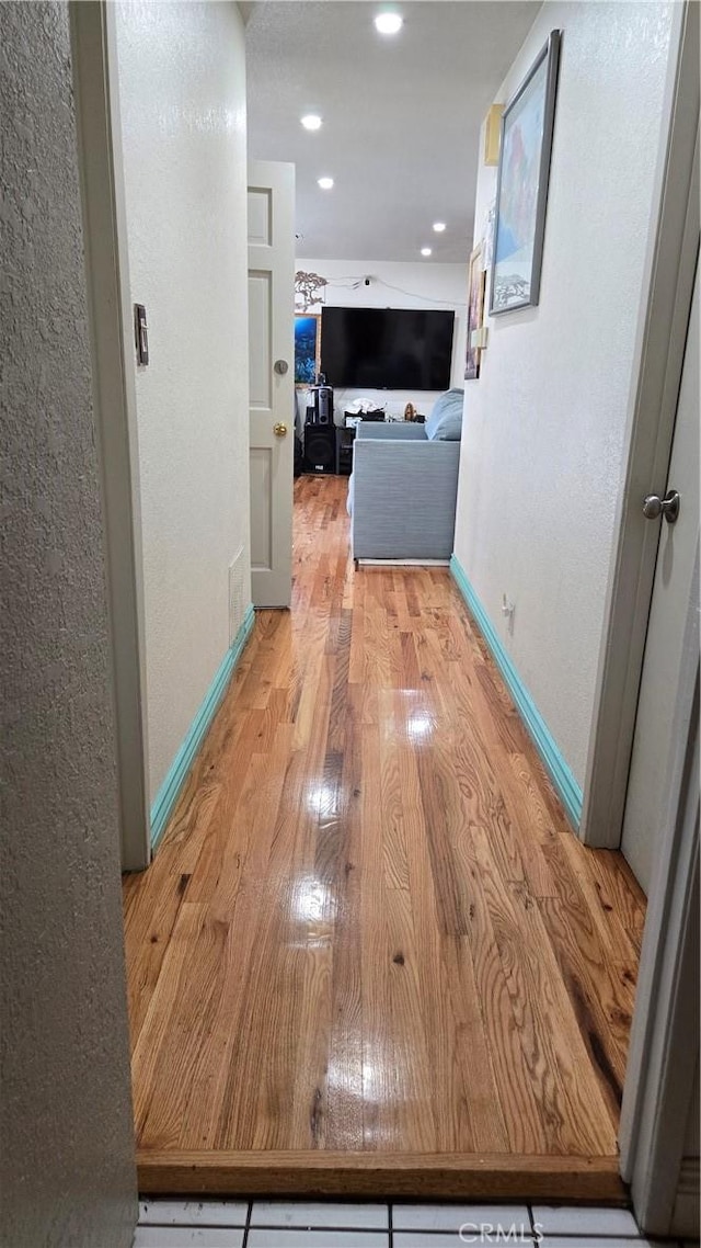 hallway with light wood-type flooring