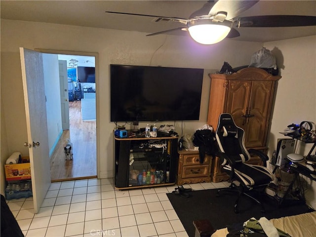 interior space featuring ceiling fan