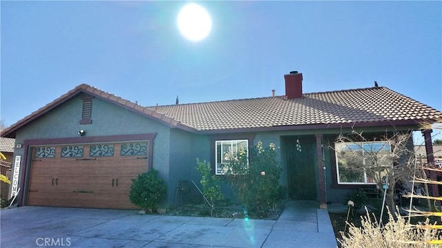 11807 Lupin Rd, Adelanto, CA 92301 - single story home with a tiled roof, a chimney, a garage, and driveway