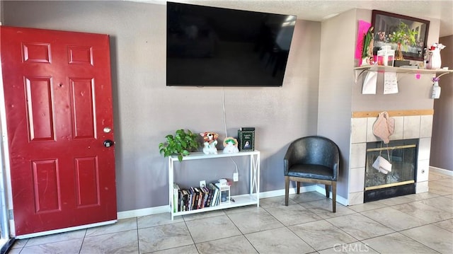 tiled foyer featuring a tile fireplace