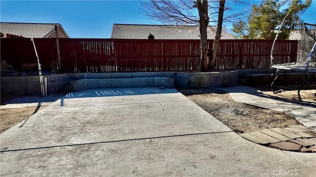 11807 Lupin Rd, Adelanto, CA 92301 - view of patio / terrace with a trampoline