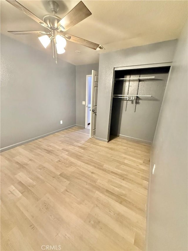 11807 Lupin Rd, Adelanto, CA 92301 - unfurnished bedroom with light wood finished floors, a closet, and baseboards