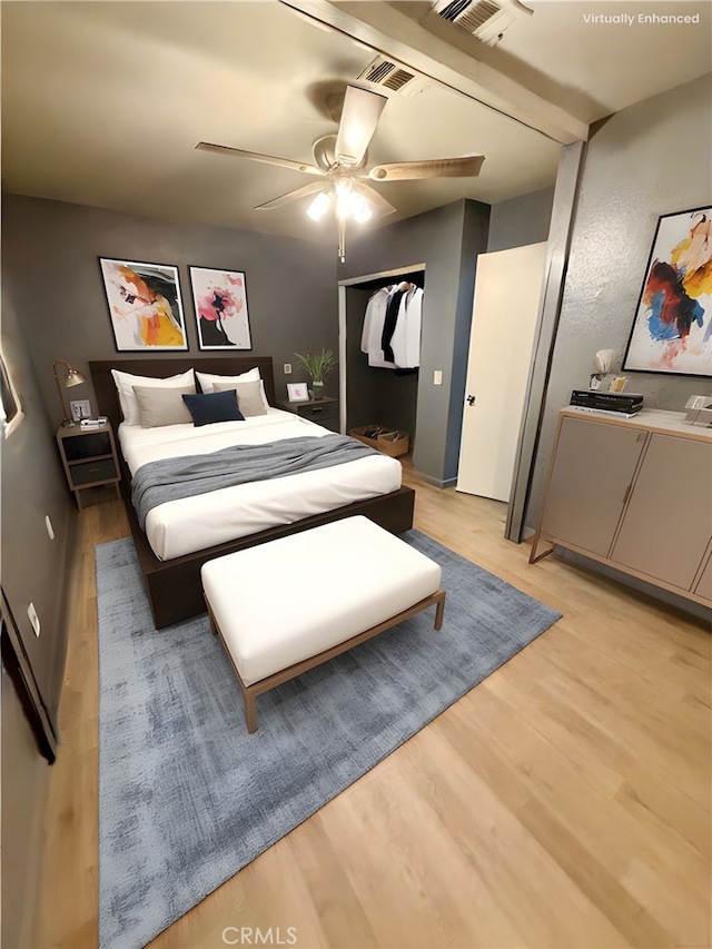 11807 Lupin Rd, Adelanto, CA 92301 - bedroom featuring light wood-style flooring, a closet, and a ceiling fan