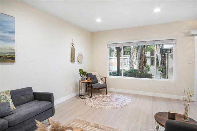 living area with light hardwood / wood-style floors