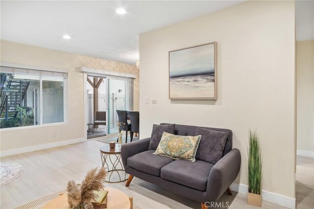 living room with light hardwood / wood-style floors