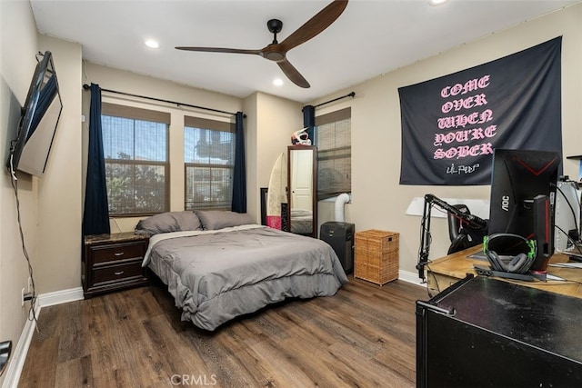 bedroom featuring dark hardwood / wood-style flooring and ceiling fan