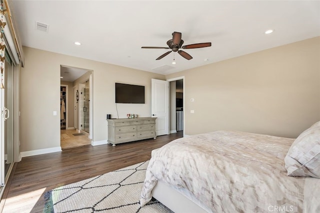 bedroom with ceiling fan and dark hardwood / wood-style floors