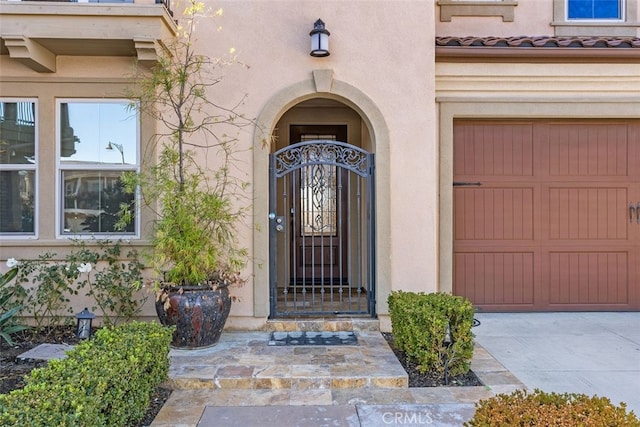 entrance to property featuring a garage