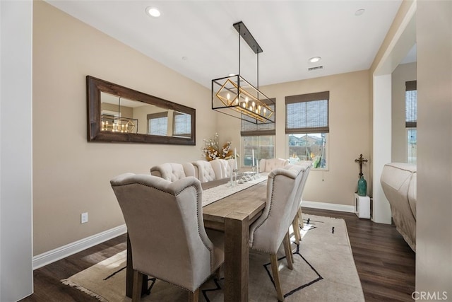 dining room with a chandelier, recessed lighting, dark wood-style flooring, visible vents, and baseboards