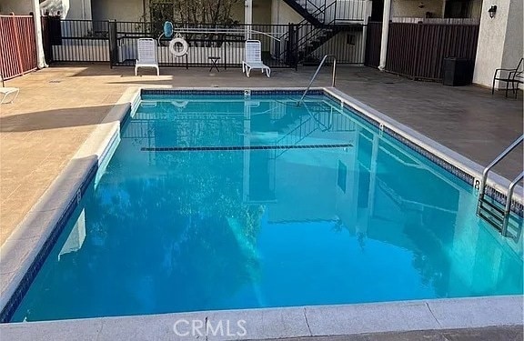 view of swimming pool featuring a patio