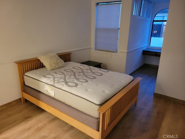 bedroom with wood-type flooring