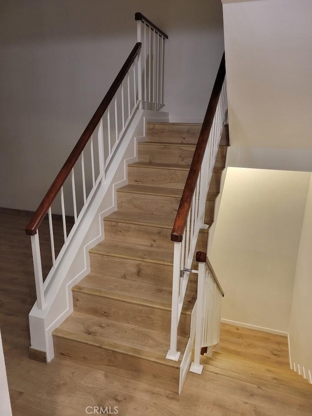 staircase featuring hardwood / wood-style floors