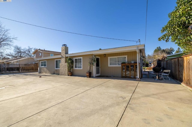 back of property featuring a patio area