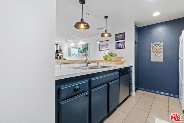 kitchen featuring blue cabinetry, decorative light fixtures, light tile patterned flooring, stainless steel dishwasher, and sink