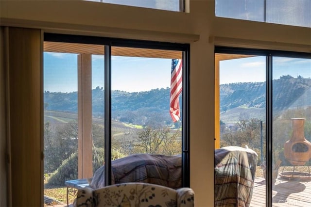 doorway to outside featuring a mountain view