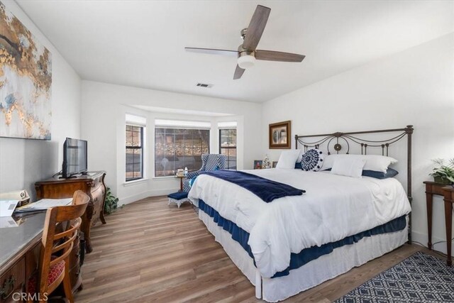 bedroom featuring hardwood / wood-style flooring and ceiling fan