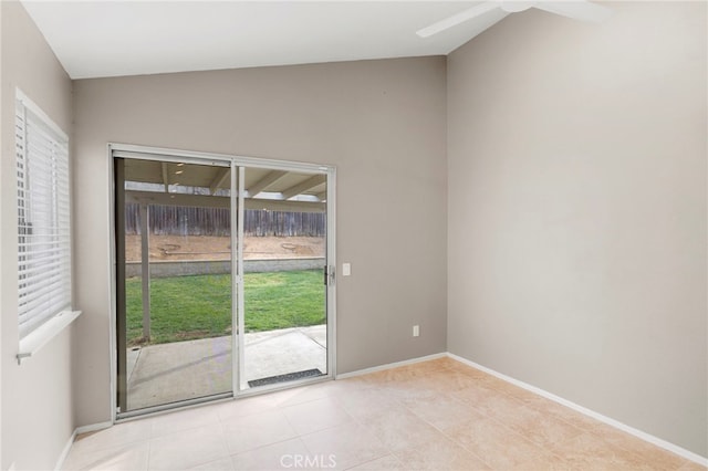 empty room featuring vaulted ceiling