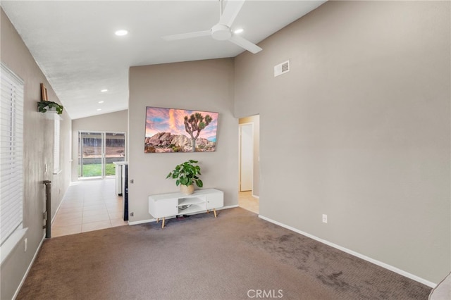 interior space featuring ceiling fan and vaulted ceiling