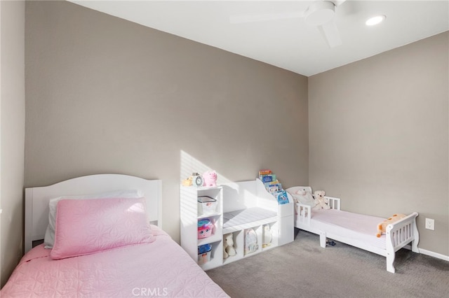 bedroom featuring ceiling fan and carpet flooring