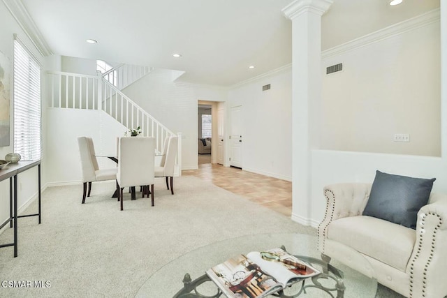 carpeted dining area featuring ornamental molding