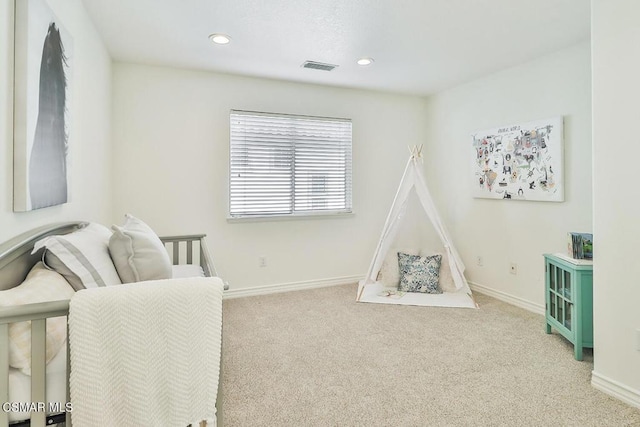 rec room with light colored carpet