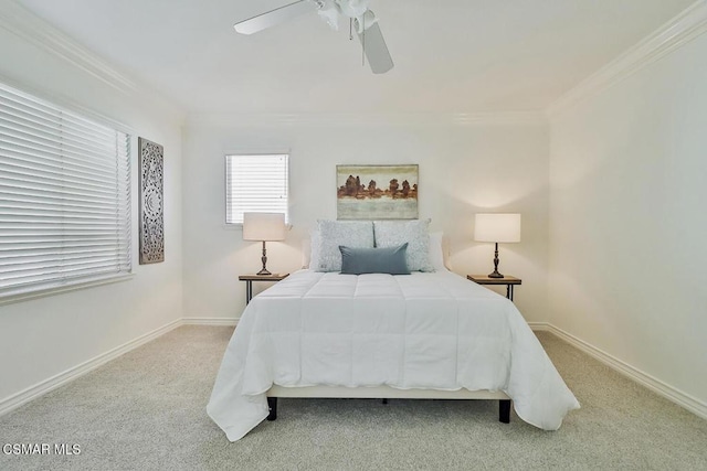 bedroom featuring ceiling fan, light colored carpet, and ornamental molding