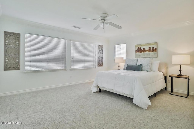 bedroom featuring ceiling fan, light carpet, and ornamental molding