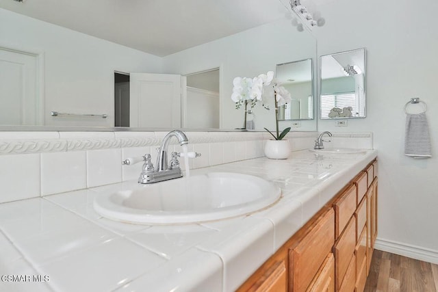 bathroom featuring vanity and wood-type flooring