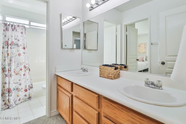 full bathroom with toilet, tile patterned flooring, vanity, and shower / tub combo with curtain