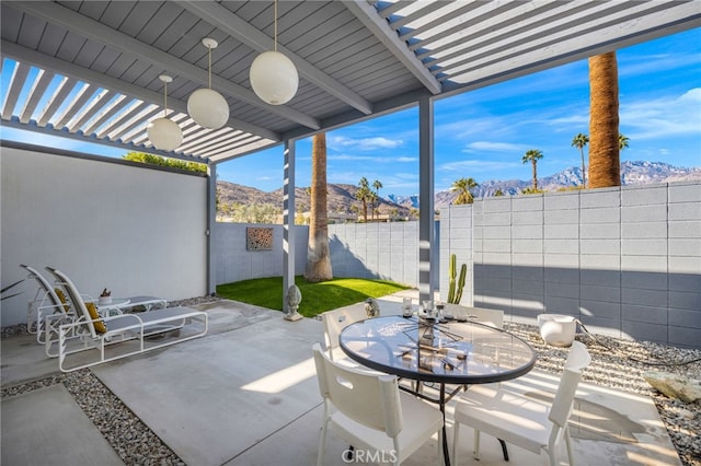 view of patio / terrace featuring a mountain view