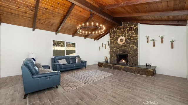 living room featuring an inviting chandelier, wood ceiling, a stone fireplace, wood-type flooring, and lofted ceiling with beams