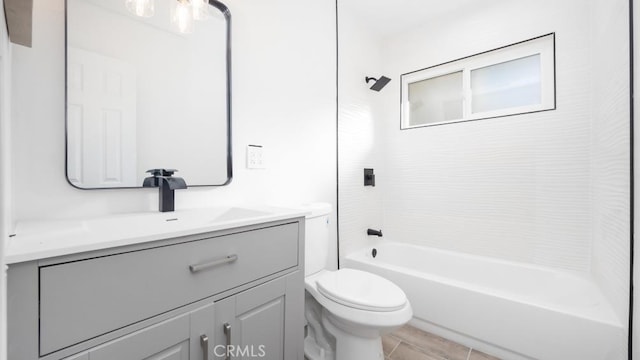 full bathroom featuring toilet, vanity, and tiled shower / bath