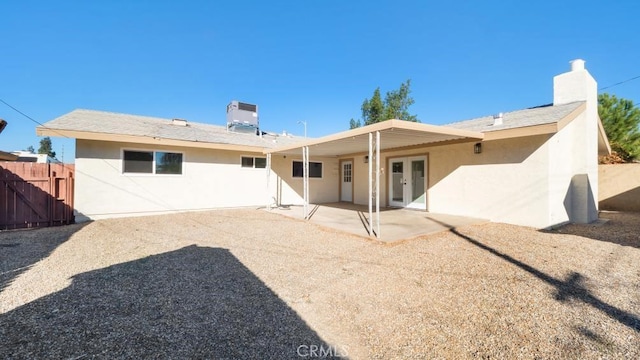 back of house with central AC unit, french doors, and a patio area