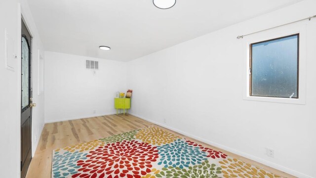 laundry room featuring hardwood / wood-style floors