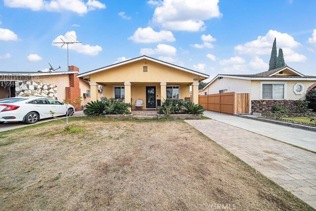 ranch-style home with covered porch