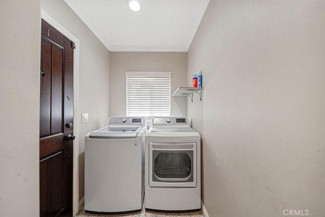 clothes washing area featuring separate washer and dryer