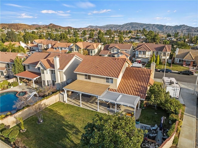 birds eye view of property featuring a mountain view