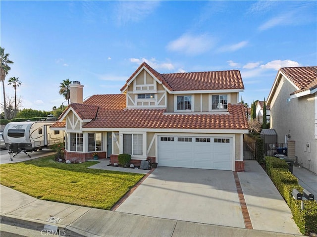 view of front of property with a front lawn and a garage