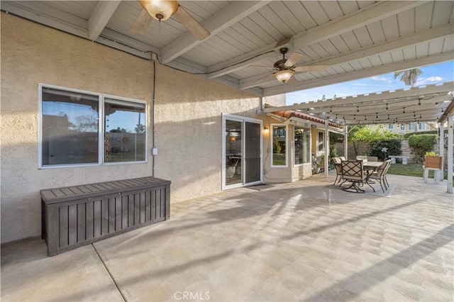 view of patio / terrace featuring ceiling fan and a pergola