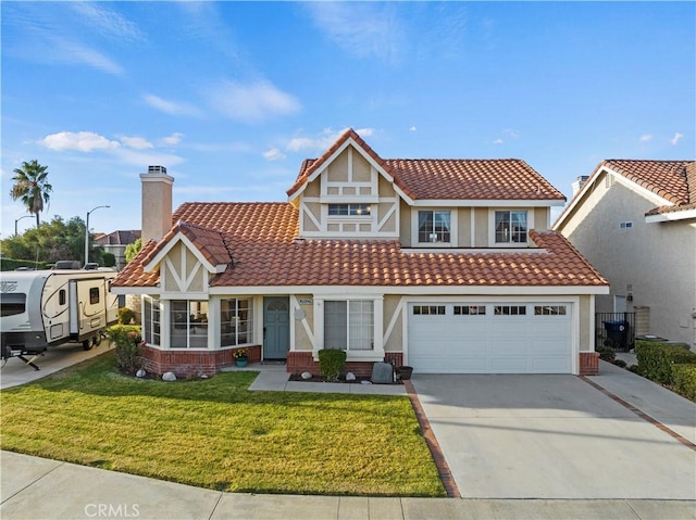 view of front of house featuring a garage and a front yard