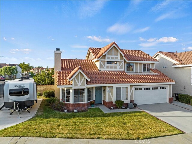 view of front of home featuring a garage and a front yard