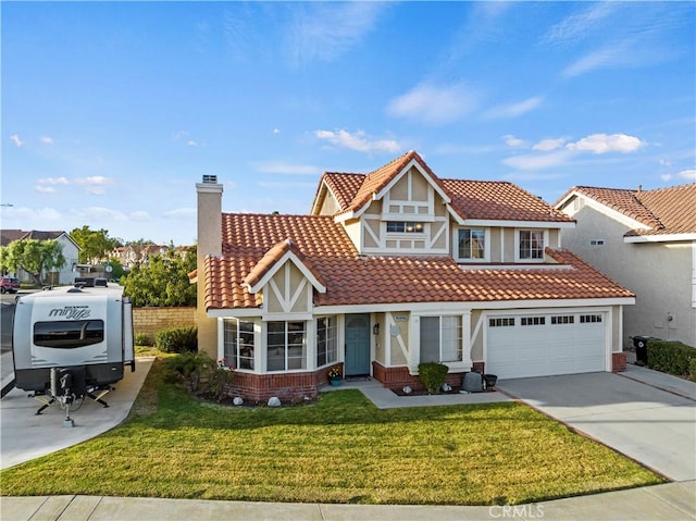 view of front of property featuring a front yard and a garage