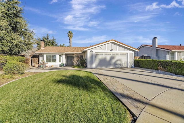 single story home with a front yard and a garage